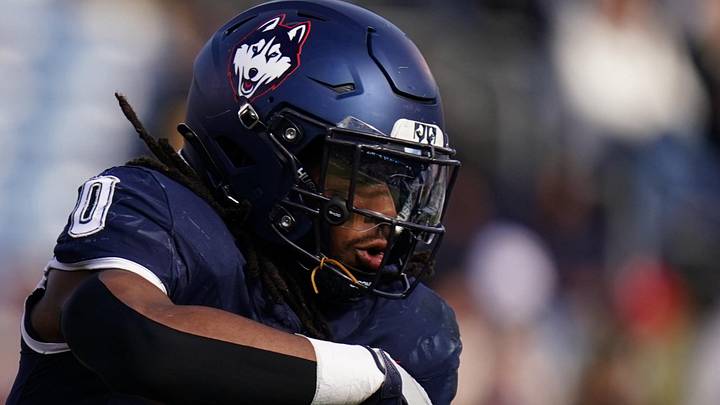Nov 15, 2025; East Hartford, Connecticut, USA; UConn Huskies quarterback Joe Fagnano (2) fakes a hand off to running back Cam Edwards (0) the Air Force Falcons in the first half at Pratt & Whitney Stadium at Rentschler Field. Mandatory Credit: David Butler II-Imagn Images
