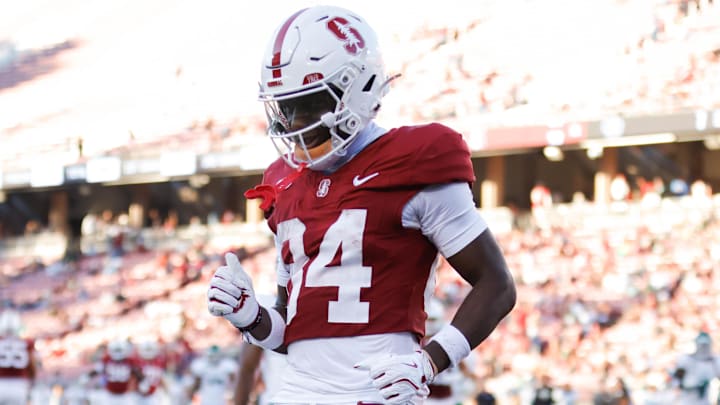 Stanford Cardinal wide receiver Ismael Cisse (84) scores a touchdown against the Cal Poly Mustangs during the second half at Stanford Stadium. 