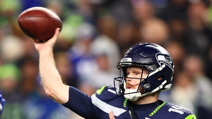 Seattle Seahawks quarterback Sam Darnold throws against Los Angeles Rams linebacker Jared Verse.