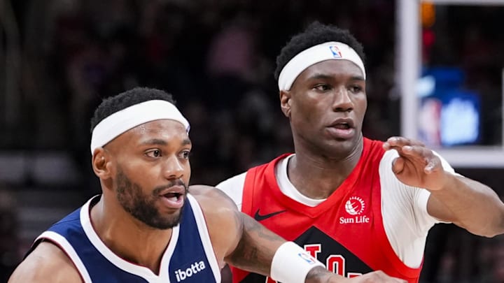 Denver Nuggets guard/forward Bruce Brown dribbles against Toronto Raptors guard Ja'Kobe Walter. Denver Nuggets guard/forward Bruce Brown dribbles against Toronto Raptors guard Ja'Kobe Walter.