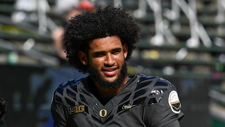 Sep 20, 2025; Eugene, Oregon, USA; Oregon Ducks quarterback Dante Moore (5) warms up before the game against the Oregon State Beavers at Autzen Stadium. Mandatory Credit: Troy Wayrynen-Imagn Images
