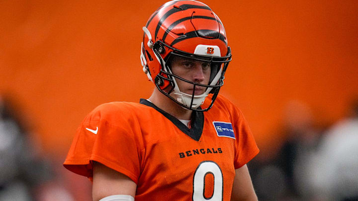 Cincinnati Bengals quarterback Joe Burrow (9) warms up before a preseason training camp practice in downtown Cincinnati on Thursday, July 31, 2025. Cincinnati Bengals quarterback Joe Burrow (9) warms up before a preseason training camp practice in downtown Cincinnati on Thursday, July 31, 2025.