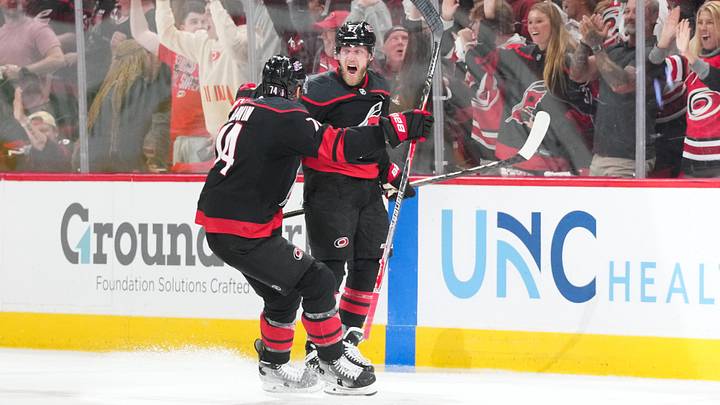 May 23, 2026; Raleigh, North Carolina, USA; Carolina Hurricanes left wing Nikolaj Ehlers (27) celebrates with Carolina Hurricanes defenseman Jaccob Slavin (74) after scoring an overtime goal against the Montréal Canadiens in game two of the Eastern Conferene Final of the 2026 Stanley Cup Playoffs at Lenovo Center. Mandatory Credit: James Guillory-Imagn Images