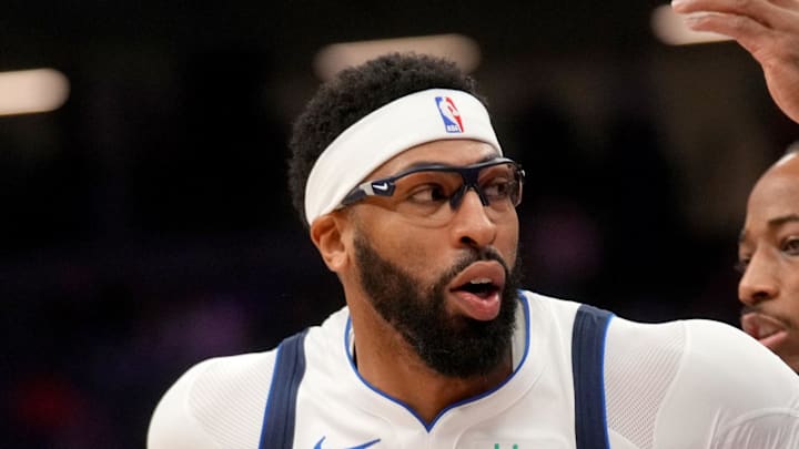 Dallas Mavericks forward Anthony Davis drives past Sacramento Kings guard DeMar DeRozan.