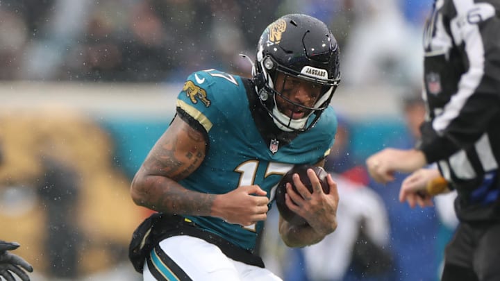 Dec 7, 2025; Jacksonville, Florida, USA;  Jacksonville Jaguars wide receiver Tim Patrick (17) makes the catch as Indianapolis Colts cornerback Jaylon Jones (40) defends during the first half at EverBank Stadium. Mandatory Credit: Matt Pendleton-Imagn Images