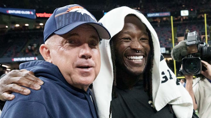 Aug 23, 2025; New Orleans, Louisiana, USA; Denver Broncos head coach Sean Payton greets New Orleans Saints running back Alvin Kamara, center, linebacker Demario Davis (56), left, and tight end Taysom Hill (7), right, at the end of the game at Caesars Superdome. Mandatory Credit: Matthew Hinton-Imagn Images