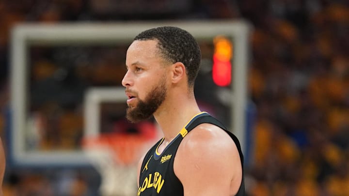 May 2, 2025; San Francisco, California, USA; Houston Rockets forward Amen Thompson (1) stands next to Golden State Warriors guard Stephen Curry (30) during a break in the action in the second quarter of game six of the first round for the 2025 NBA Playoffs at Chase Center. Mandatory Credit: Cary Edmondson-Imagn Images