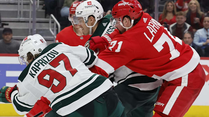 Mar 10, 2022; Detroit, Michigan, USA;  Minnesota Wild left wing Kirill Kaprizov (97)ref10 scores a goal on Detroit Red Wings goaltender Alex Nedeljkovic (39) in the third period at Little Caesars Arena. Mandatory Credit: Rick Osentoski-Imagn Images