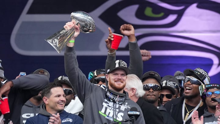 Feb 11, 2026; Seattle, WA, USA; Seattle Seahawks quarterback Sam Darnold holds the Vince Lombardi trophy during the Super Bowl LX trophy celebration at Lumen Field. Mandatory Credit: Kirby Lee-Imagn Images
