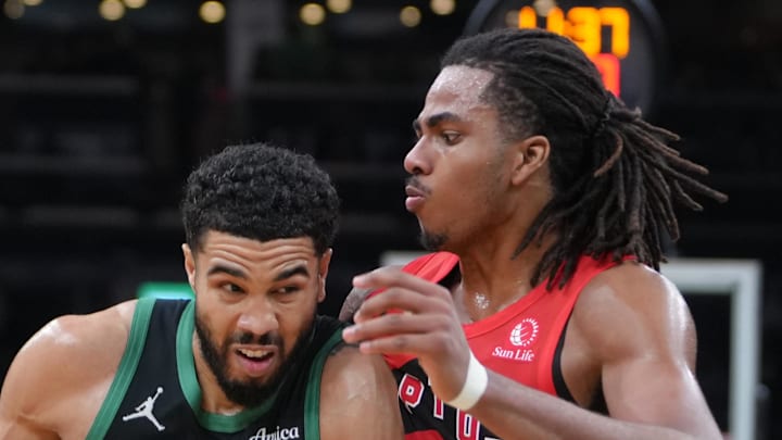 Boston Celtics forward Jayson Tatum drives the ball against Toronto Raptors forward Collin Murray-Boyles.