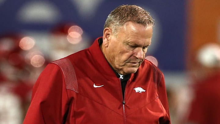 Arkansas Razorbacks coach Sam Pittman walks to mid-field during warm ups prior to the game against the Texas Tech Red Raiders  at Simmons Bank Liberty Stadium.