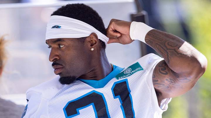 Carolina Panthers safety Nick Scott rides to practice during training camp. Carolina Panthers safety Nick Scott rides to practice during training camp.
