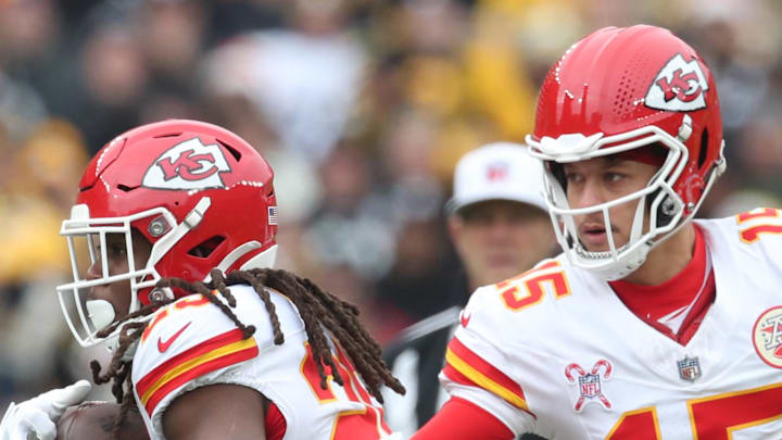 Dec 25, 2024; Pittsburgh, Pennsylvania, USA;  Kansas City Chiefs running back Kareem Hunt (29) takes a hand-off from quarterback Patrick Mahomes (15) against the Pittsburgh Steelers during the first quarter at Acrisure Stadium. Mandatory Credit: Charles LeClaire-Imagn Images