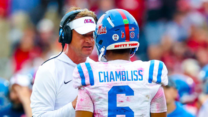Oct 25, 2025; Norman, Oklahoma, USA;  Ole Miss Rebels head coach Lane Kiffin speaks with Ole Miss Rebels quarterback Trinidad Chambliss (6) during the second half at Gaylord Family-Oklahoma Memorial Stadium. Mandatory Credit: Kevin Jairaj-Imagn Images