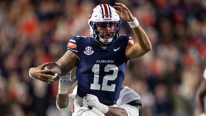 Auburn Tigers quarterback Ashton Daniels (12) runs the ball as Auburn Tigers take on Alabama Crimson Tide in the Iron Bowl at Jordan-Hare Stadium in Auburn, Ala. on Saturday, Nov. 29, 2025. Alabama Crimson Tide leads Auburn Tigers 17-6. Auburn Tigers quarterback Ashton Daniels (12) runs the ball as Auburn Tigers take on Alabama Crimson Tide in the Iron Bowl at Jordan-Hare Stadium in Auburn, Ala. on Saturday, Nov. 29, 2025. Alabama Crimson Tide leads Auburn Tigers 17-6.