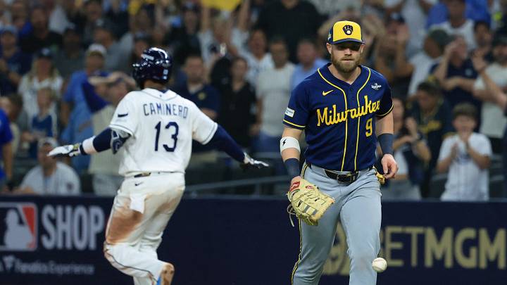 Oct 27, 2026; St. Petersburg, Florida, USA; Tampa Bay Rays third baseman Junior Caminero (13) is safe at first base as Milwaukee Brewers first baseman Jake Bauers (9) is unable to catch a throw during the twelfth inning in game four of the 2026 World Series at Tropicana Field. Mandatory Credit: Kim Klement Neitzel-Imagn Images Oct 27, 2026; St. Petersburg, Florida, USA; Tampa Bay Rays third baseman Junior Caminero (13) is safe at first base as Milwaukee Brewers first baseman Jake Bauers (9) is unable to catch a throw during the twelfth inning in game four of the 2026 World Series at Tropicana Field. Mandatory Credit: Kim Klement Neitzel-Imagn Images