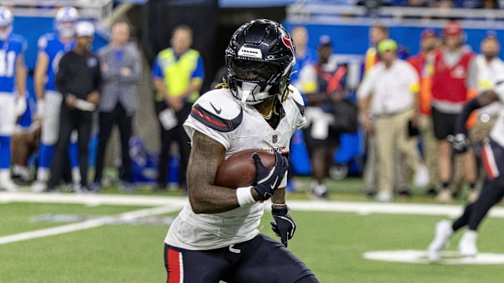 Aug 23, 2025; Detroit, Michigan, USA; Houston Texans cornerback Jalen Mills (26) runs with the ball after his interception against the Detroit Lions during the second half at Ford Field. Mandatory Credit: David Reginek-Imagn Images