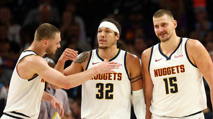 Mar 24, 2026; Phoenix, Arizona, USA; Denver Nuggets guard Christian Braun (0) celebrates with forward Aaron Gordon (32) and center Nikola Jokic (15) against the Phoenix Suns in the first half at Mortgage Matchup Center. Mandatory Credit: Mark J. Rebilas-Imagn Images Mar 24, 2026; Phoenix, Arizona, USA; Denver Nuggets guard Christian Braun (0) celebrates with forward Aaron Gordon (32) and center Nikola Jokic (15) against the Phoenix Suns in the first half at Mortgage Matchup Center. Mandatory Credit: Mark J. Rebilas-Imagn Images