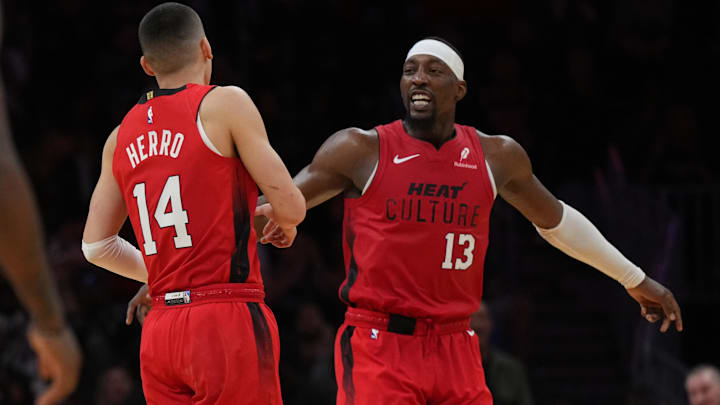 Dec 7, 2024; Miami, Florida, USA;  Miami Heat center Bam Adebayo (13) celebrates with guard Tyler Herro (14) after Herro made a three-point basket against the Phoenix Suns during the second half at Kaseya Center. Mandatory Credit: Jim Rassol-Imagn Images