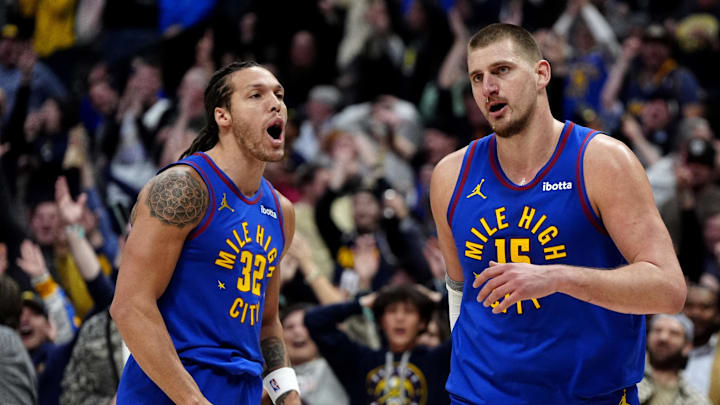 Jan 23, 2025; Denver, Colorado, USA; Denver Nuggets center Nikola Jokic (15) reacts along side forward Aaron Gordon (32)  following a full court basket made in the second half against the Sacramento Kings at Ball Arena.