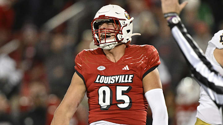 Oct 7, 2023; Louisville, Kentucky, USA;  Louisville Cardinals defensive lineman Mason Reiger (95) reacts after sacking Notre Dame Fighting Irish quarterback Sam Hartman (10) during the first half at L&N Federal Credit Union Stadium. 