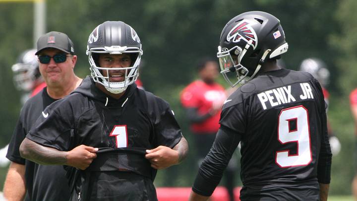 Tua Tagovailoa and Michael Penix Jr. working together at Atlanta Falcons OTAs.