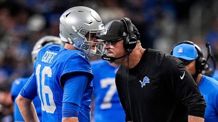 Detroit Lions quarterback Jared Goff (16) talks to head coach Dan Campbell before a play against Packers Detroit Lions quarterback Jared Goff (16) talks to head coach Dan Campbell before a play against Packers