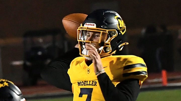 Matt Ponatoski eyes a touchdown pass for Moeller during the OHSAA Division I football regional semifinals Nov. 15, 2024, at Dwire Field in Mason, Ohio. Matt Ponatoski eyes a touchdown pass for Moeller during the OHSAA Division I football regional semifinals Nov. 15, 2024, at Dwire Field in Mason, Ohio.