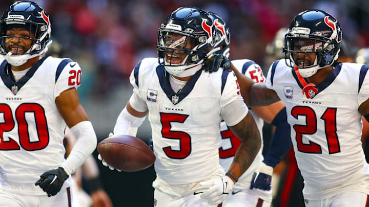 Oct 8, 2023; Atlanta, Georgia, USA; Houston Texans safety Jalen Pitre (5) celebrates with cornerback Ka'dar Hollman (20) and cornerback Steven Nelson (21) after a fumble recovery against the Atlanta Falcons in the second half at Mercedes-Benz Stadium. Mandatory Credit: Brett Davis-Imagn Images