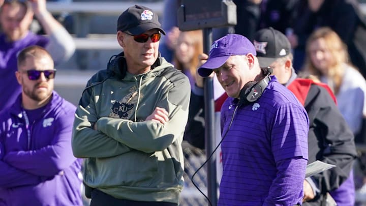 Nov 6, 2021; Lawrence, Kansas, USA; Kansas Jayhawks head coach Lance Leipold (left) talks with Kansas State Wildcats head coach Chris Klieman during an injury time out during the first half at David Booth Kansas Memorial Stadium. Mandatory Credit: Denny Medley-Imagn Images Nov 6, 2021; Lawrence, Kansas, USA; Kansas Jayhawks head coach Lance Leipold (left) talks with Kansas State Wildcats head coach Chris Klieman during an injury time out during the first half at David Booth Kansas Memorial Stadium. Mandatory Credit: Denny Medley-Imagn Images
