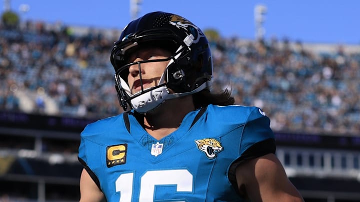 Jacksonville Jaguars quarterback Trevor Lawrence (16) scores a touchdown on a keeper during the first quarter of an NFL football matchup at EverBank Stadium, Sunday, Dec. 14, 2025, in Jacksonville, Fla. The Jaguars defeated the Jets 48-20.