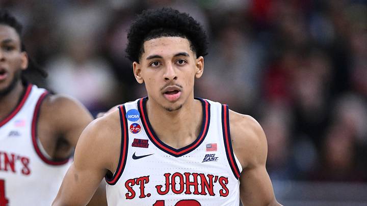 St. John's Red Storm guard RJ Luis Jr. (12) dribbles during the second half of a second round men’s NCAA Tournament game against the Arkansas Razorbacks at Amica Mutual Pavilion. 