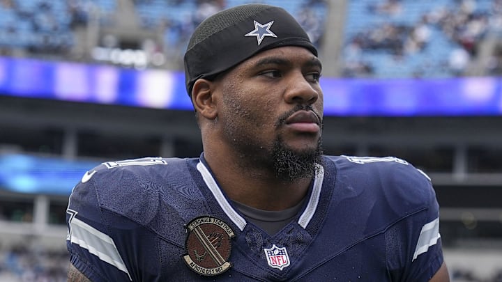 Dec 15, 2024; Charlotte, North Carolina, USA; Dallas Cowboys linebacker Micah Parsons (11) walks onto the field during the first quarter against the Carolina Panthers at Bank of America Stadium. Mandatory Credit: Jim Dedmon-Imagn Images