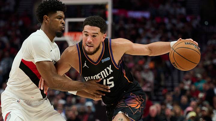 Oct 21, 2026; Portland, Oregon, USA; Phoenix Suns guard Devin Booker (15) drives to the basket during the second half against Portland Trail Blazers guard Scoot Henderson (00) at Moda Center. Mandatory Credit: Troy Wayrynen-Imagn Images