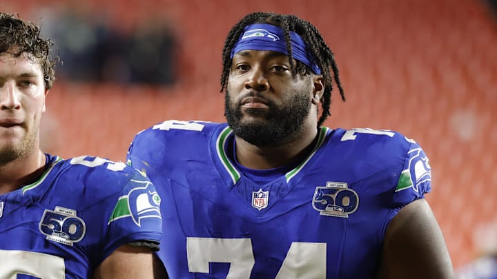 Nov 2, 2025; Landover, Maryland, USA; Seattle Seahawks linebacker Connor O'Toole (57) and Seahawks guard Josh Jones (74) walk off the field after defeating the Washington Commanders at Northwest Stadium. Mandatory Credit: Amber Searls-Imagn Images