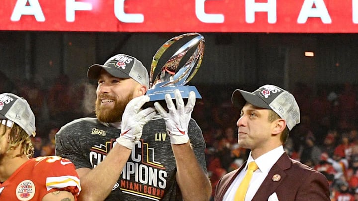 Jan 19, 2020; Kansas City, Missouri, USA; Kansas City Chiefs former player Bobby Bell and CBS sportscaster Jim Nantz and Kansas City Chiefs quarterback Patrick Mahomes (15) and strong safety Tyrann Mathieu (32) and tight end Travis Kelce (87) and general manager Brett Veach (left to right) celebrate on stage after the AFC Championship Game against the Tennessee Titans at Arrowhead Stadium. Mandatory Credit: Denny Medley-Imagn Images
