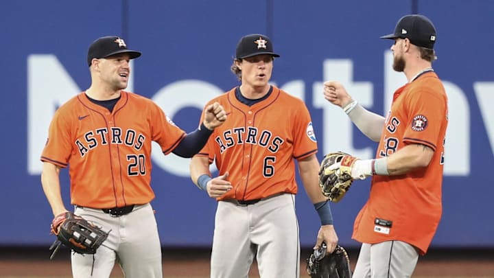 Jun 30, 2024; New York City, New York, USA;  Houston Astros outfielder Chas McCormick (20), center fielder Jake Meyers (6) and right fielder Trey Cabbage (38) celebrate after defeating New York Mets 10-5 at Citi Field. 