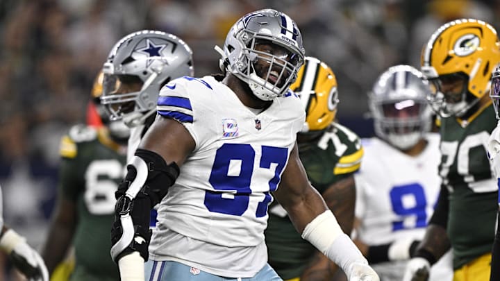 Sep 28, 2025; Arlington, Texas, USA;  Dallas Cowboys defensive tackle Osa Odighizuwa (97) reacts after defending against the Green Bay Packers in the first quarter at AT&T Stadium. Mandatory Credit: Jerome Miron-Imagn Images