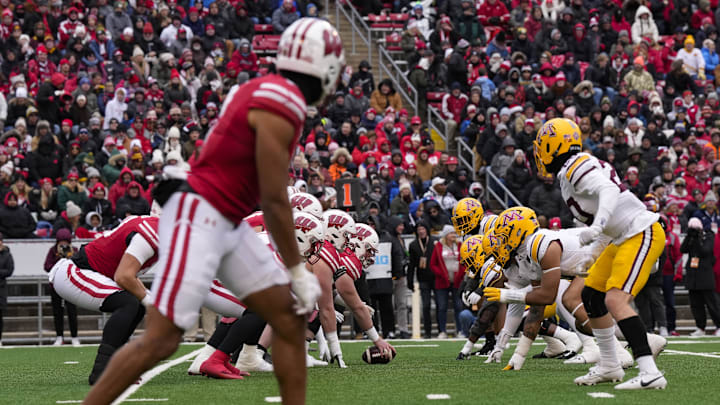 Nov 29, 2024; Madison, Wisconsin, USA;  The Wisconsin Badgers line up for a play during the second quarter against the Minnesota Golden Gophers at Camp Randall Stadium.