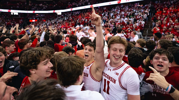 Zach Kinziger celebrates on the Kohl Center floor after Wisconsin's 92-71 victory over No. 10 Michigan State.