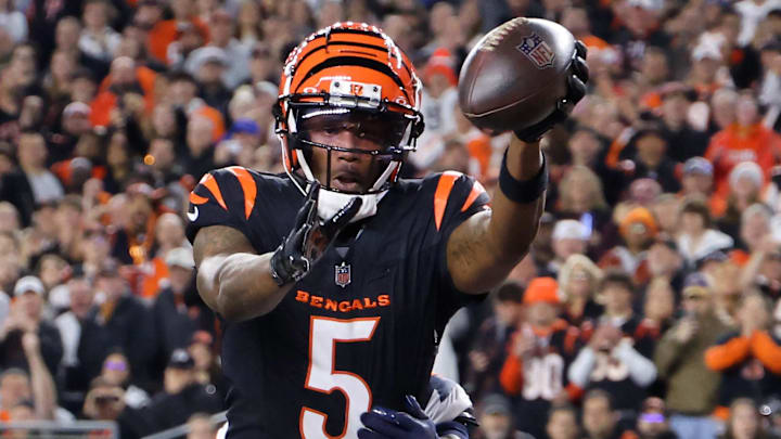 Dec 28, 2024; Cincinnati, Ohio, USA;  Cincinnati Bengals wide receiver Tee Higgins (5) catches a touchdown pass against the Denver Broncos during the second quarter at Paycor Stadium. Mandatory Credit: Joseph Maiorana-Imagn Images