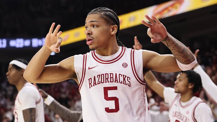 Jan 3, 2026; Fayetteville, Arkansas, USA; Arkansas Razorbacks guard Darius Acuff Jr (5) reacts to a made three by a teammate during the second half against the Tennessee Volunteers at Bud Walton Arena. Mandatory Credit: Nelson Chenault-Imagn Images