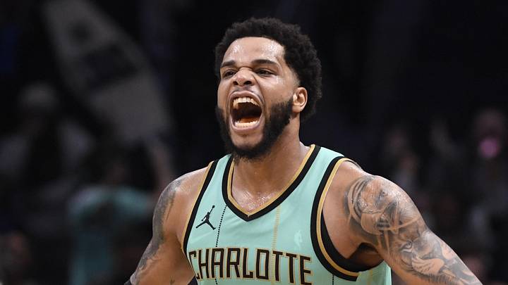 Dec 30, 2024; Charlotte, North Carolina, USA;  Charlotte Hornets forward Miles Bridges (0) reacts after scoring during the second half against the Chicago Bulls at the Spectrum Center. Mandatory Credit: Sam Sharpe-Imagn Images
