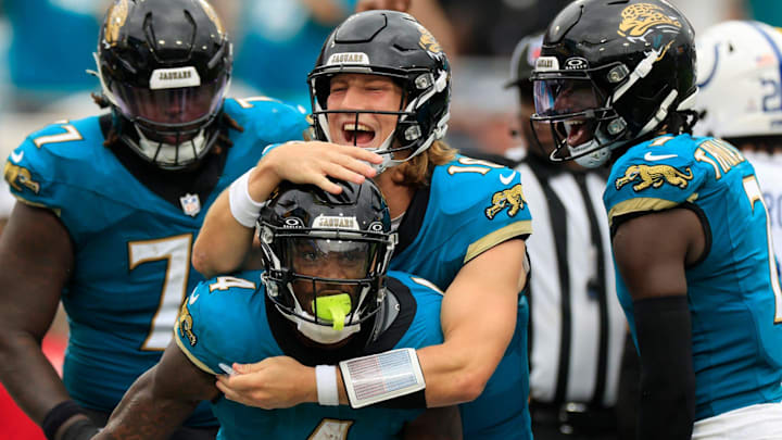 Jacksonville Jaguars quarterback Trevor Lawrence (16) celebrates a touchdown scored by running back Tank Bigsby (4) during the third quarter of NFL football matchup Sunday, Oct. 6, 2024 at EverBank Stadium in Jacksonville, Fla. The Jaguars edged the Colts on a field goal 37-34. Jacksonville Jaguars quarterback Trevor Lawrence (16) celebrates a touchdown scored by running back Tank Bigsby (4) during the third quarter of NFL football matchup Sunday, Oct. 6, 2024 at EverBank Stadium in Jacksonville, Fla. The Jaguars edged the Colts on a field goal 37-34.