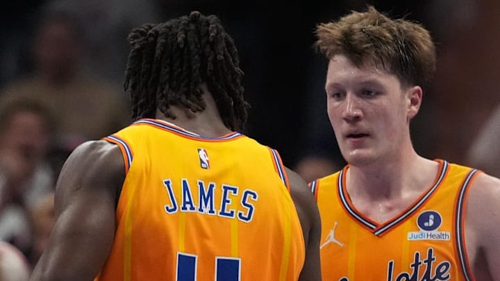 Mar 26, 2026; Charlotte, North Carolina, USA; Charlotte Hornets guard Sion James (4) and guard/forward Kon Knueppel (7) celebrate the win over New York Knicks during the second half at the Spectrum Center. Mandatory Credit: Jim Dedmon-Imagn Images