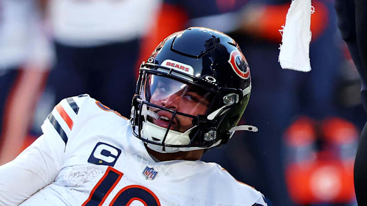 Oct 27, 2024; Landover, Maryland, USA; Chicago Bears quarterback Caleb Williams (18) reacts after being tackled during the second quarter against the Washington Commanders at Commanders Field. Mandatory Credit: Peter Casey-Imagn Images