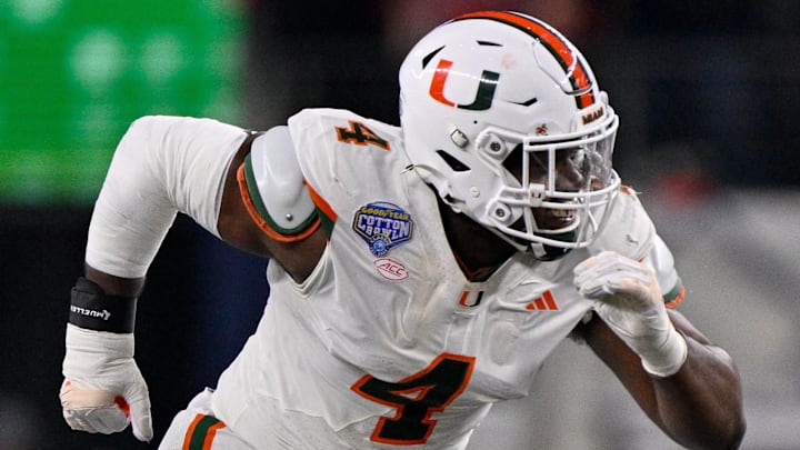 Dec 31, 2025; Arlington, TX, USA; Miami Hurricanes defensive lineman Rueben Bain Jr. (4) rushes the line during the 2025 Cotton Bowl and quarterfinal game of the College Football Playoff at AT&T Stadium. Mandatory Credit: Jerome Miron-Imagn Images