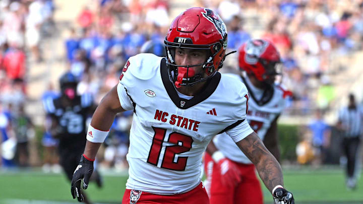 Sep 20, 2025; Durham, North Carolina, USA;  North Carolina State Wolfpack wide receiver Teddy Hoffmann (12) goes for the ball against the Duke Blue Devils during the first quarter at Wallace Wade Stadium. Mandatory Credit: Zachary Taft-Imagn Images