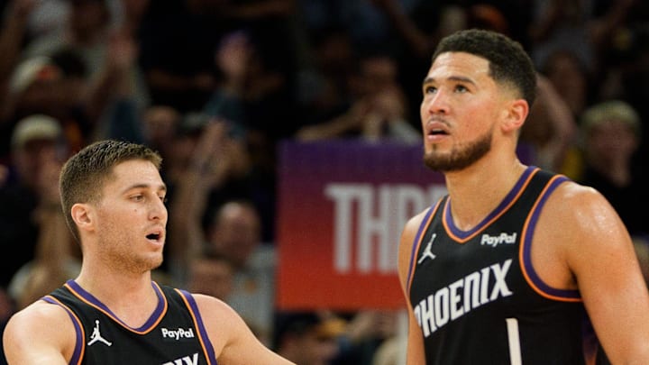 Dec 14, 2025; Phoenix, Arizona, USA; Phoenix Suns guard Devin Booker (1) and guard Collin Gillespie (12) react after the Sun take the lead late in the second half of a game against the Los Angeles Lakers at Mortgage Matchup Center. Mandatory Credit: Allan Henry-Imagn Images Dec 14, 2025; Phoenix, Arizona, USA; Phoenix Suns guard Devin Booker (1) and guard Collin Gillespie (12) react after the Sun take the lead late in the second half of a game against the Los Angeles Lakers at Mortgage Matchup Center. Mandatory Credit: Allan Henry-Imagn Images