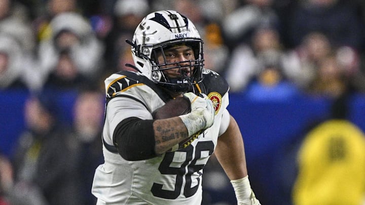 Dec 14, 2024; Landover, Maryland, USA;  Navy Midshipmen defensive tackle Landon Robinson (96) runs on a fake punt during the second half  against the Army Black Knights at Commanders Field. Mandatory Credit: Tommy Gilligan-Imagn Images